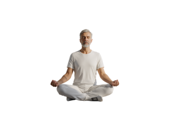Calm senior man practicing yoga and meditation in a peaceful lotus pose on a white isolated background.