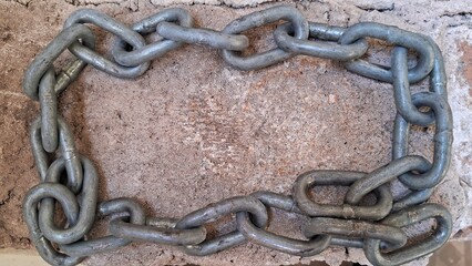 Metal Chain Frame on Concrete Surface