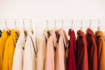 Colorful coats hanging on display in a store