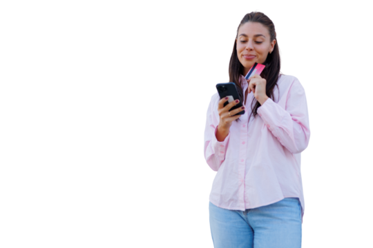 Woman processing online payment, smartphone and credit card in hand, against transparent backdrop