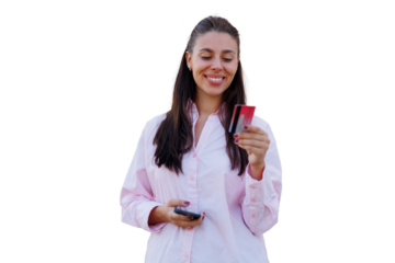 Smiling female shopper displaying credit card, using smartphone for hassle-free digital payment against clean white background