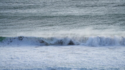 Dramatic seascape with a powerful ocean wave crashing on the shore in Cape Town South Africa...