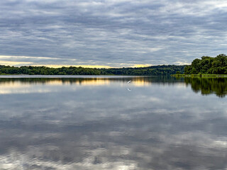 grey lake and overcast sky on a Midwest evening 