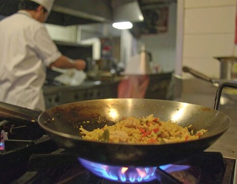 Chef cooking stir-fry