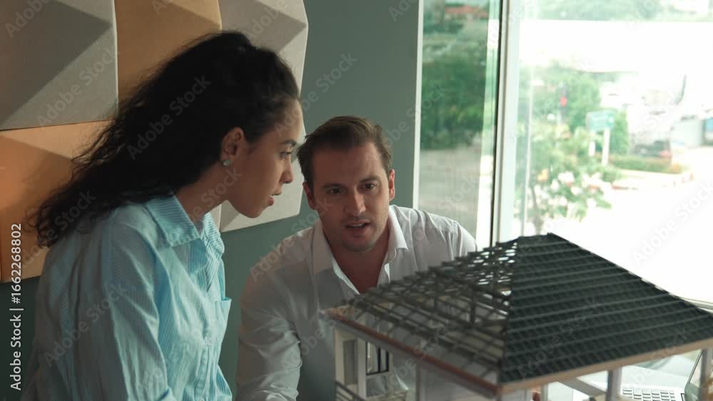Poster two skilled professional architect engineer team discuss about house model structure. project manage
