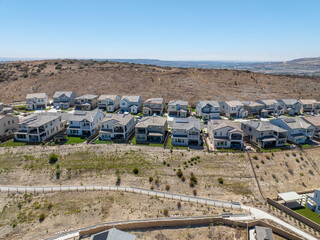 New development real estate. Aerial view of residential houses and driveways neighborhood in south San Diego, Chula Vista. Packed homes. Top view over private houses