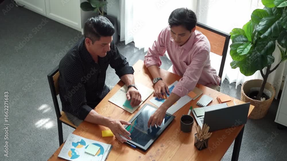 Poster top view of business team working together to analysis data by using tablet on meeting table. divers