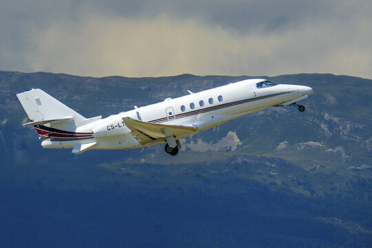 Geneva, Switzerland - August 22, 2025 :  sign and logo on a Cessna Citation Latitude of NetJets take off from Geneva airport