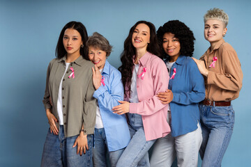 Women supporting breast cancer awareness campaign posing together