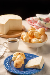 Cheese bread, table with coffee cheese bread and semi-cured cheese from Brazil, selective focus.