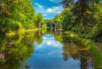 Wandcirkels Rakotzbrücke Diabelski Most (niem. Rakotzbrücke) w Kromlau, Niemcy  © grzegorz_pakula