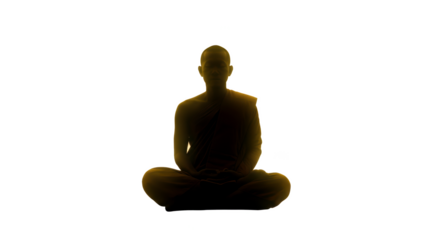 Silhouette of a person meditating in lotus position against a dark background with a golden glow effect