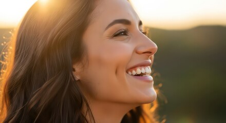 A joyful woman's profile, beaming with happiness, against a backdrop of warm sunset hues, showcasing radiant skin and a vibrant smile.