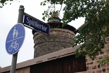 Street Sign Spittlertor With Tower And Wall In Nuremberg, Germany.