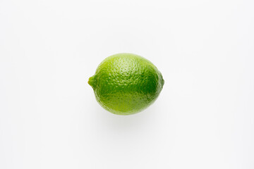 Fresh bright green lime on a white background.