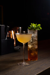 Double layer drink with ice in a bar in a glass
