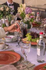 A festive table on a sunny day with lots of snacks