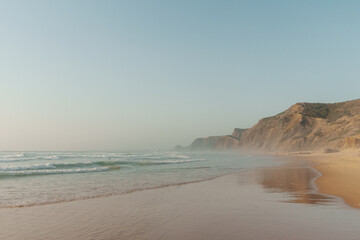 Golden hour reflections and cliffs at Praia da Cordoama, Algarve, Portugal