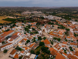 Aerial view of Silves Cathedral and Castle in historic town center, Algarve, Portugal