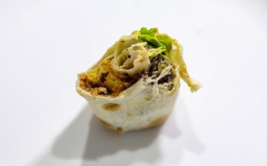 Traditional Mexican food, fajita, tortilla with meat, guacamole, black bean chili and salad