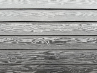 schwarze HPL Fassade mit Holzstruktur 