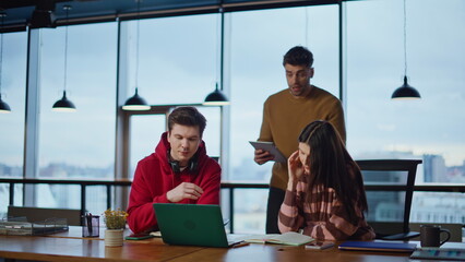 Stressed colleagues complaining video meeting in office coworking space. 