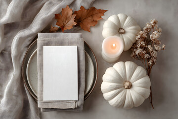 bright elegant menu or invitation card mockup with festive autumn / fall themed table setting with white pumpkins, candle and natural leaf, ideal for thanksgiving or seasonal weddings - flat lay