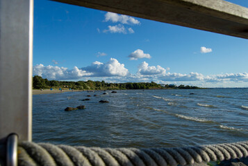 sea, clouds, waves against blue sky