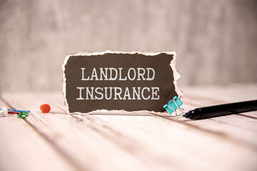 text LANDLORD INSURANCE on white card
