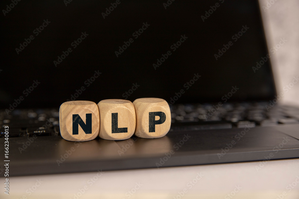 Poster hand holding wood cube block with nlp text.