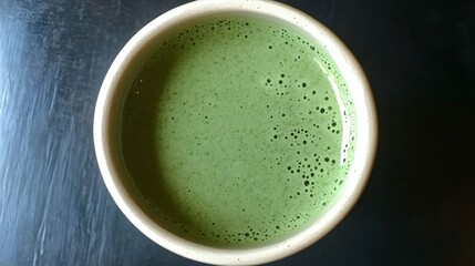 Overhead View of Frothy Matcha Latte in Cup