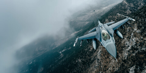 F16 Fighting Falcon flying with high altitude over the mountains
