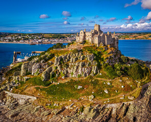 Aerial view of St Michael&rsquo;s Mount island with harbor, boats, and castle