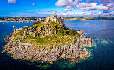 Aerial view of St Michael&rsquo;s Mount island with harbor, boats, and castle