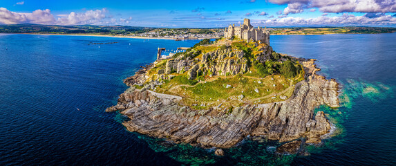 Aerial view of St Michael&rsquo;s Mount island with harbor, boats, and castle
