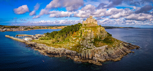 Aerial view of St Michael&rsquo;s Mount island with harbor, boats, and castle