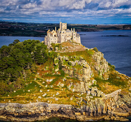Aerial view of St Michael&rsquo;s Mount island with harbor, boats, and castle