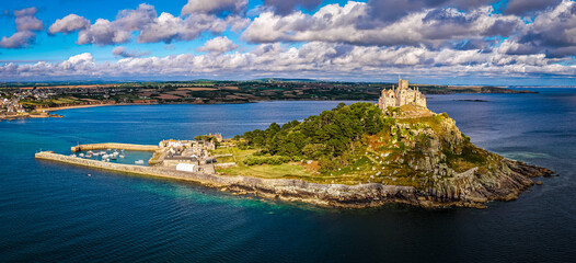 Aerial view of St Michael&rsquo;s Mount island with harbor, boats, and castle