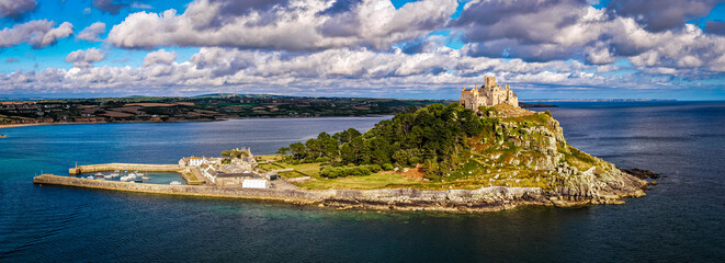 Aerial view of St Michael&rsquo;s Mount island with harbor, boats, and castle