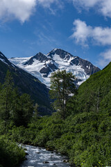 Obraz premium Byron Creek. Byron Glacier Road, Anchorage is in Southcentral Alaska. yron Peak is located in the Chugach National Forest at the head of a short, steep-walled valley, and rises above Portage Lake.
