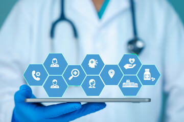Doctor holding digital tablet with medical technology icons, healthcare innovation concept