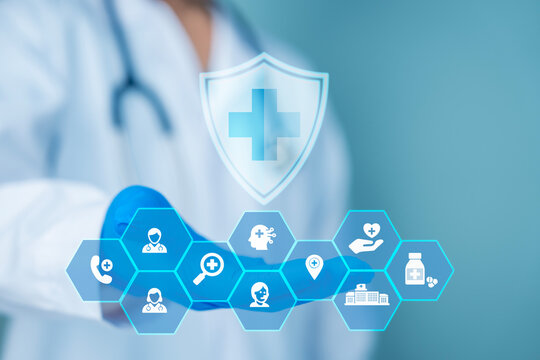 Health insurance concept with doctor holding digital shield and medical technology icons
