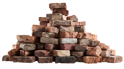 Pile of assorted used bricks against a black background.