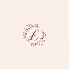Cursive letter L logo inside a delicate circular botanical frame with handdrawn leaves and berries.