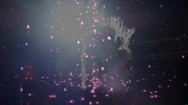 Concert music kicking, female singer headbanging and singing into mic with sparkles and harmony