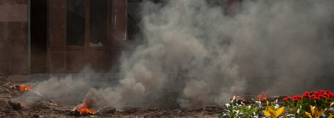 abstract background with smoke after explosion on city street without people
