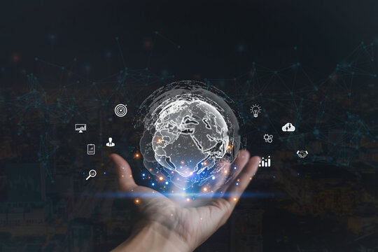 Futuristic digital globe above human hand with data network and technology icons, symbolizing global connection, innovation, cloud computing, business strategy, and artificial intelligence.