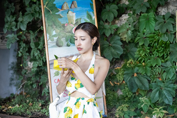 Fresh from farm woman grab yellow lemon sorbet gelato in Capri, Italy.