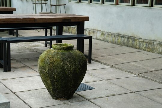 Gentong or barell of water for washing hand, in yard. Made from teracotta or clay. Gentong Air