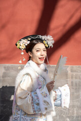 Woman wearing traditional Chinese dress in the ancient City, Beijing, China.